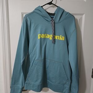 Patagonia Blue Hoodie with Yellow Text